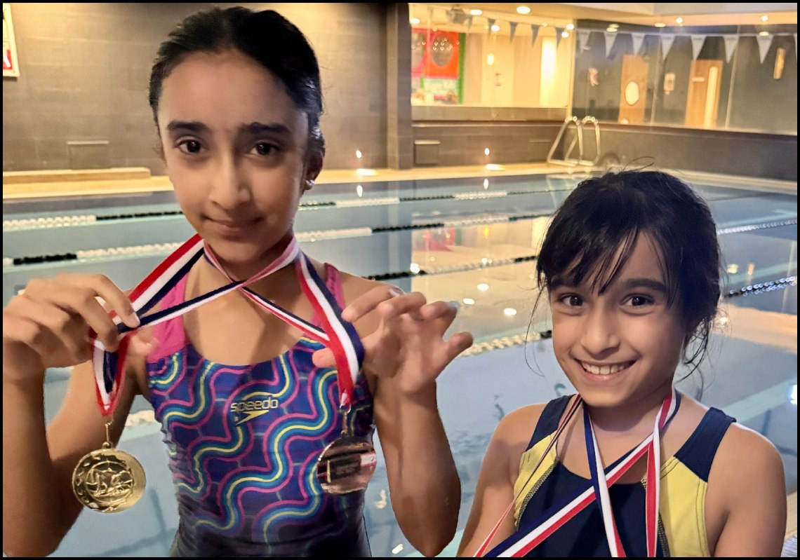 Bhela and Reeya Swimming Medals